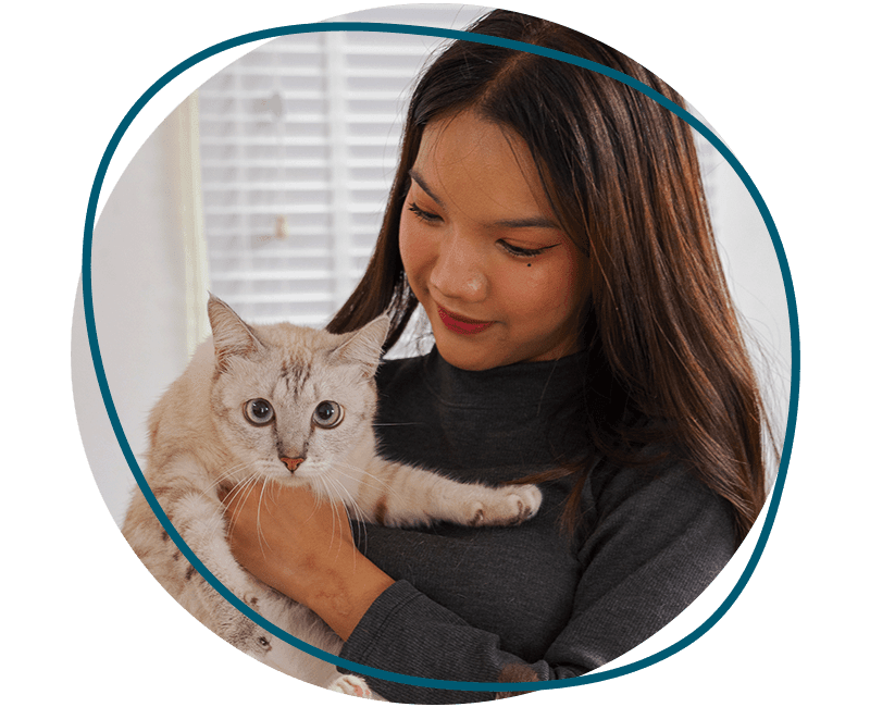 woman holding white cat